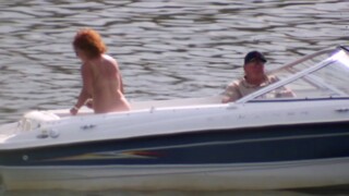 Huge natural boobed redhead MILF on a boat