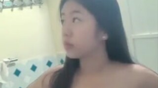 Busty asian showering