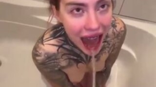 Slut enjoys being pissed on