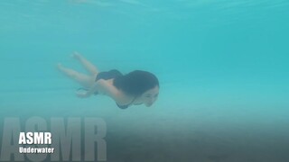 Sexy bikini woman swimming under water 3