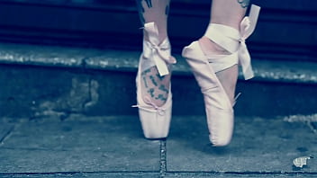 Ballerina Wearing Ballet Shoes and Walking Down The Street